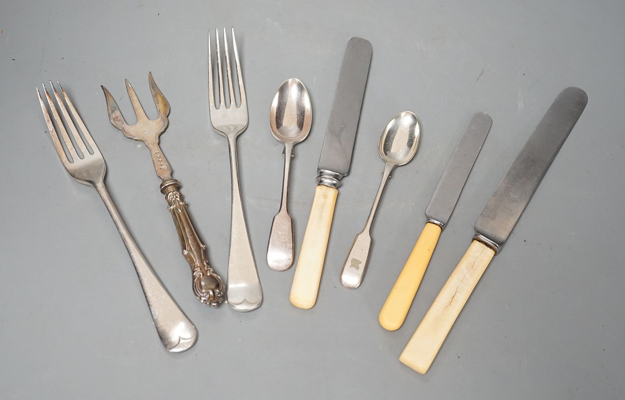 A large quantity of assorted plated cutlery, including fish knives and forks and servers and three cased sets.